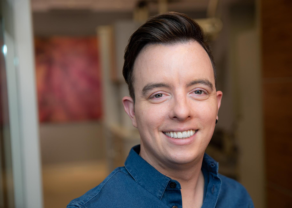 Patient smiling with his new veneers and invisalign treatment Vancouver, BC