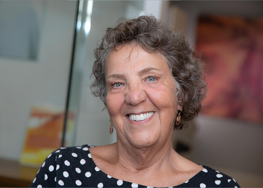 patient showing her dental implants Vancouver, BC